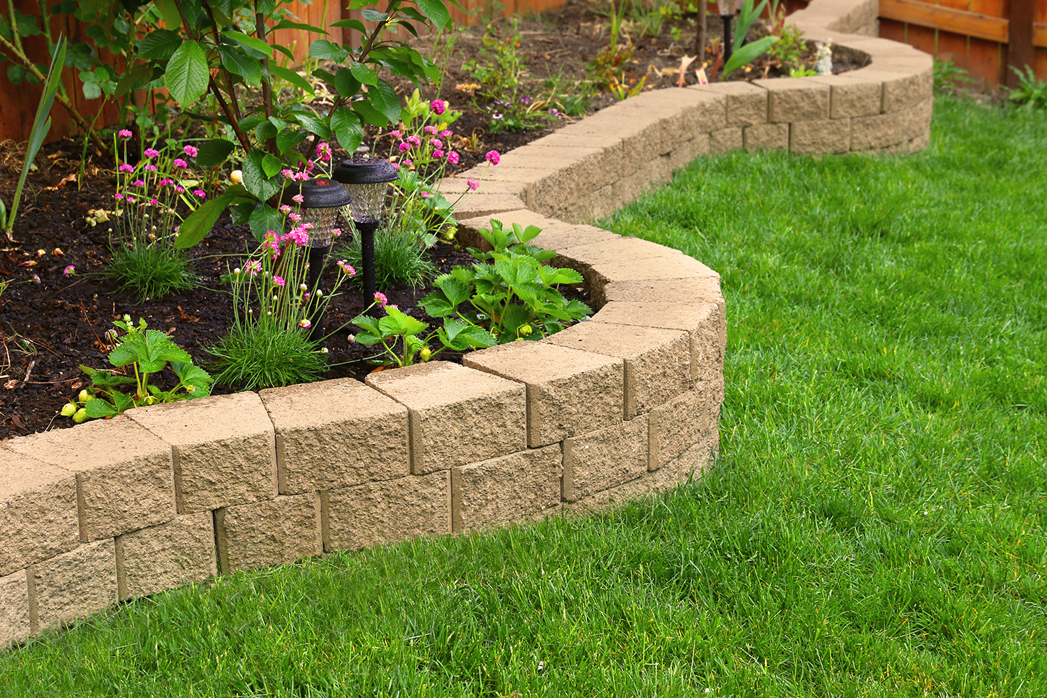 stone wall with perfect grass landscaping